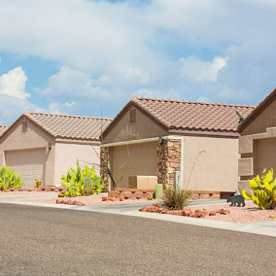 Four garages and an Asphalt Road | Roof Arizona Heat