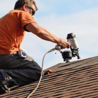 A Roofer Conducting Roof Maintenance | Roof Repair and Maintenance