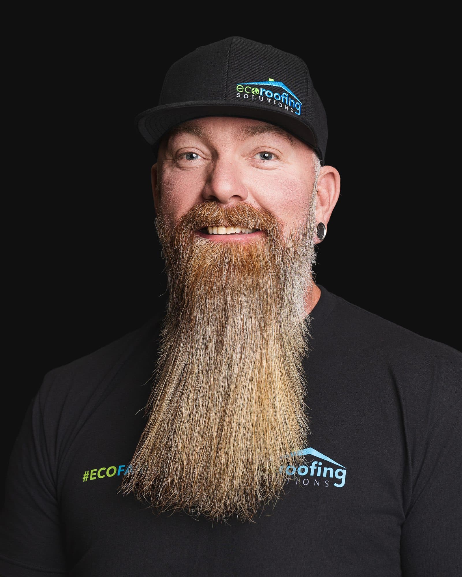 Eric Perry, Owner and President of Eco Roofing Solutions, in a branded cap and #ECOFAMILY tee